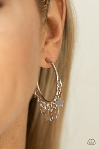 Happy Independence Day - Silver Hoop Earrings - Paparazzi Accessories A shiny collection of silver star charms trickles from the bottom of a classic silver hoop, creating a stellar fringe. Earring attaches to a standard post fitting. Hoop measures approximately 1 1/4" in diameter.  Sold as one pair of hoop earrings.