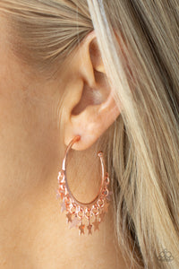 Happy Independence Day - Copper Hoop Earrings - Paparazzi Accessories A collection of shiny copper star charms trickles from the bottom of a shiny copper hoop, creating a stellar fringe. Earring attaches to a standard post fitting. Hoop measures approximately 1 1/4" in diameter.  Sold as one pair of hoop earrings.  New Kit