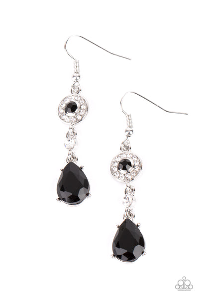 Graceful Glimmer - Black Earrings - Paparazzi Accessories A silver frame dotted in glassy black and white rhinestones, a solitaire white rhinestone, and an oversized black teardrop gem delicately link into a graceful lure. Earring attaches to a standard fishhook fitting.  Sold as one pair of earrings.  New Kit