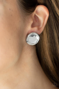 Double-Take Twinkle - White Post Earrings - Paparazzi Accessories Featuring a flashy faceted finish, an oversized white gem is pressed into a sleek silver fitting for a dramatic pop of dazzle. Earring attaches to a standard post fitting.  Sold as one pair of post earrings.  New Kit