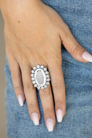 Bling Of All Bling - White Ring - Paparazzi Accessories White rhinestone encrusted petals bloom from an oversized white gem, creating a dramatic centerpiece atop the finger. Features a stretchy band for a flexible fit.  Sold as one individual ring.  New Kit