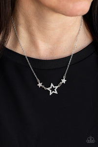 United We Sparkle - White Necklace - Paparazzi Accessories A white rhinestone encrusted silver star is flanked by two dainty white rhinestone encrusted silver stars, creating a sparkly patriotic pendant below the collar. Features an adjustable clasp closure.  Sold as one individual necklace. Includes one pair of matching earrings.  New Kit