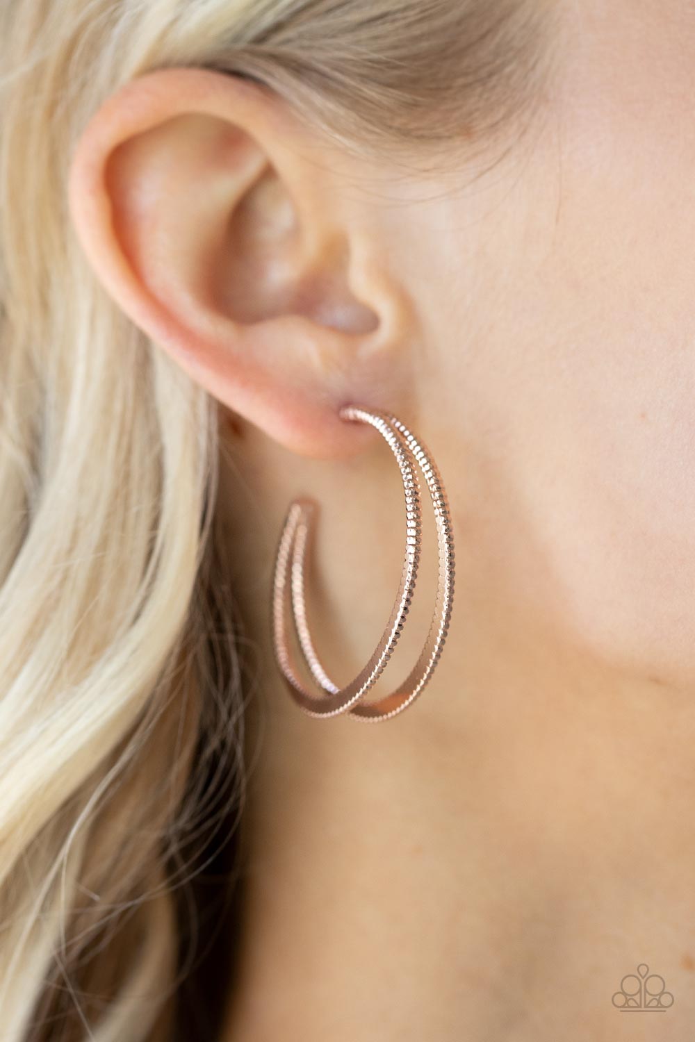 Rustic Curves - Rose Gold Hoop Earrings - Paparazzi Accessories Featuring textured edges, two rose gold crescent frames delicately curve into a bold double hoop for an edgy urban look. Earring attaches to a standard post fitting. Hoop measures approximately 1 1/2" in diameter.  Sold as one pair of hoop earrings.  New Kit