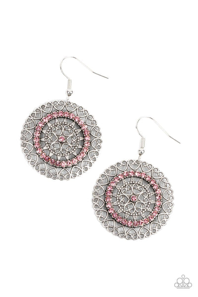 Fairytale Finale - Pink Earrings - Paparazzi Accessories Silver heart shaped filigree frames spin into an enchanting display. Infused with a ring of glassy pink rhinestones, the center of the airy frame is dotted with a solitaire pink rhinestone for a romantic finish. Earring attaches to a standard fishhook fitting.  Sold as one pair of earrings.