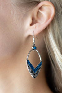 Indigenous Intentions - Blue Earrings - Paparazzi Accessories Two rows of Mykonos Blue seed beads create a V at the bottom of an airy silver frame embossed and stamped in indigenous inspired patterns. A matching Mykonos Blue seed bead adorns the top of the frame, adding additional color to the seasonal display. Earring attaches to a standard fishhook fitting.  Sold as one pair of earrings.  New Kit