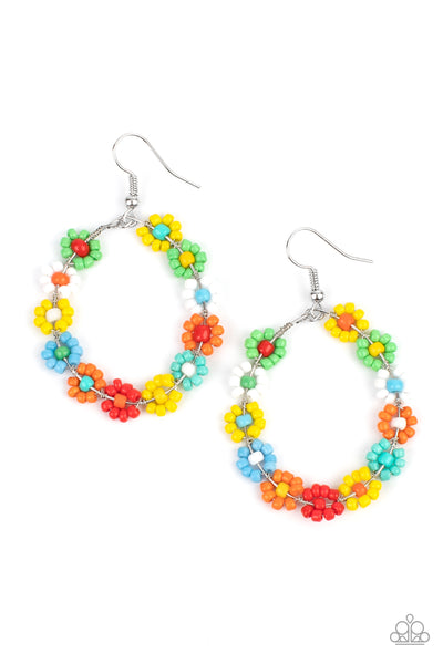 Festively Flower Child - Multi Earrings - Paparazzi Accessories Dotted with mismatched multicolored beaded centers, a dainty collection of multicolored seed beaded floral frames are threaded along a wire hoop for a fabulous floral fashion. Earring attaches to a standard fishhook fitting.  Sold as one pair of earrings.  New Kit