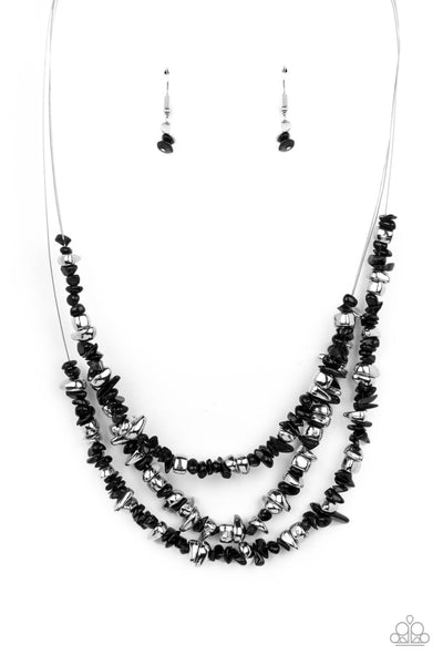 Placid Pebbles - Black Necklace - Paparazzi Accessories An earthy collection of raw cut silver and black pebbles are threaded along dainty wires below the collar, creating refreshing layers. Features an adjustable clasp closure.  Sold as one individual necklace. Includes one pair of matching earrings.  New Kit