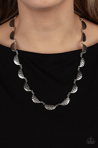 Lunar Jungle - Silver Necklace - Paparazzi Accessories A celestial display of hammered half-moon silver discs link together for a cosmic charm below the collar. Features an adjustable clasp closure.  Sold as one individual necklace. Includes one pair of matching earrings.