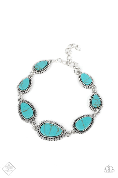 Elemental Exploration - Blue Bracelet - Paparazzi Accessories Encased in frames of flattened silver studs, pieces of flat turquoise stone teardrops gradually increase in size as they link around the wrist for an artisan-inspired look. Features an adjustable clasp closure.  Sold as one individual bracelet.  New Kit Fashion Fix