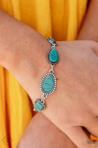 Elemental Exploration - Blue Bracelet - Paparazzi Accessories Encased in frames of flattened silver studs, pieces of flat turquoise stone teardrops gradually increase in size as they link around the wrist for an artisan-inspired look. Features an adjustable clasp closure.  Sold as one individual bracelet.  New Kit Fashion Fix