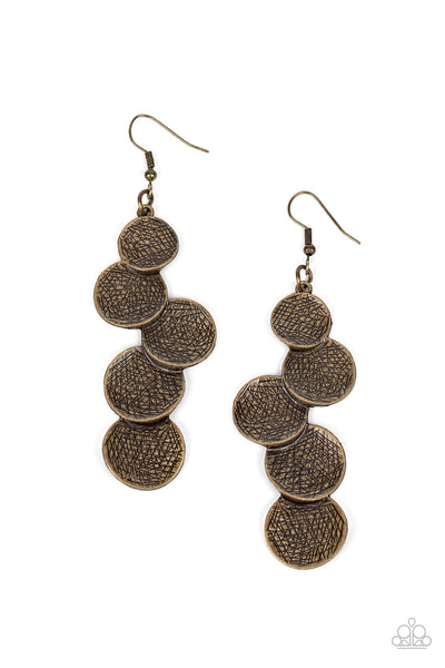 Token Gesture - Brass Earrings - Paparazzi Accessories Scratched in edgy shimmer, beveled brass discs gradually increase in size as they overlap into a demanding display. Earring attaches to a standard fishhook fitting.  Sold as one pair of earrings.