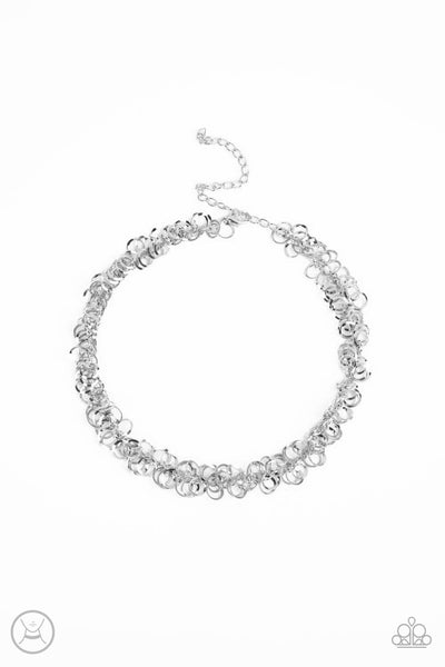 Cause a Commotion - Silver Choker Necklace - Paparazzi Accessories A shiny series of flat and beveled silver hoops delicately cluster along a dainty silver chain around the neck, creating a tinkling fringe. Features an adjustable clasp closure.  Sold as one individual choker necklace. Includes one pair of matching earrings.  New Kit Choker