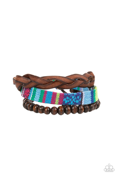 Textile Texting - Blue Bracelet - Paparazzi Accessories An earthy compilation of wooden beads, braided leather, and colorful textile fabric layers around the wrist for an adventurous fashion. Features an adjustable sliding knot closure.  Sold as one individual bracelet.