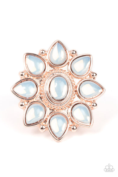 Enchanted Orchard - Rose Gold Ring - Paparazzi Accessories Dewy opal teardrop beads bloom from a matching oval beaded center, resulting in an ethereal floral pattern atop a studded rose gold backdrop. Features a stretchy band for a flexible fit.  Sold as one individual ring.  New Kit