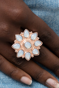 Enchanted Orchard - Rose Gold Ring - Paparazzi Accessories Dewy opal teardrop beads bloom from a matching oval beaded center, resulting in an ethereal floral pattern atop a studded rose gold backdrop. Features a stretchy band for a flexible fit.  Sold as one individual ring.  New Kit