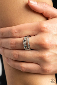 Fractal Fascination - Silver Ring - Paparazzi Accessories Infused with a timeless band of white rhinestones, a dainty collection of trapezoidal cut smoky and white rhinestones staggers across the finger for a glamorously layered look. Features a dainty stretchy band for a flexible fit.  Sold as one individual ring.