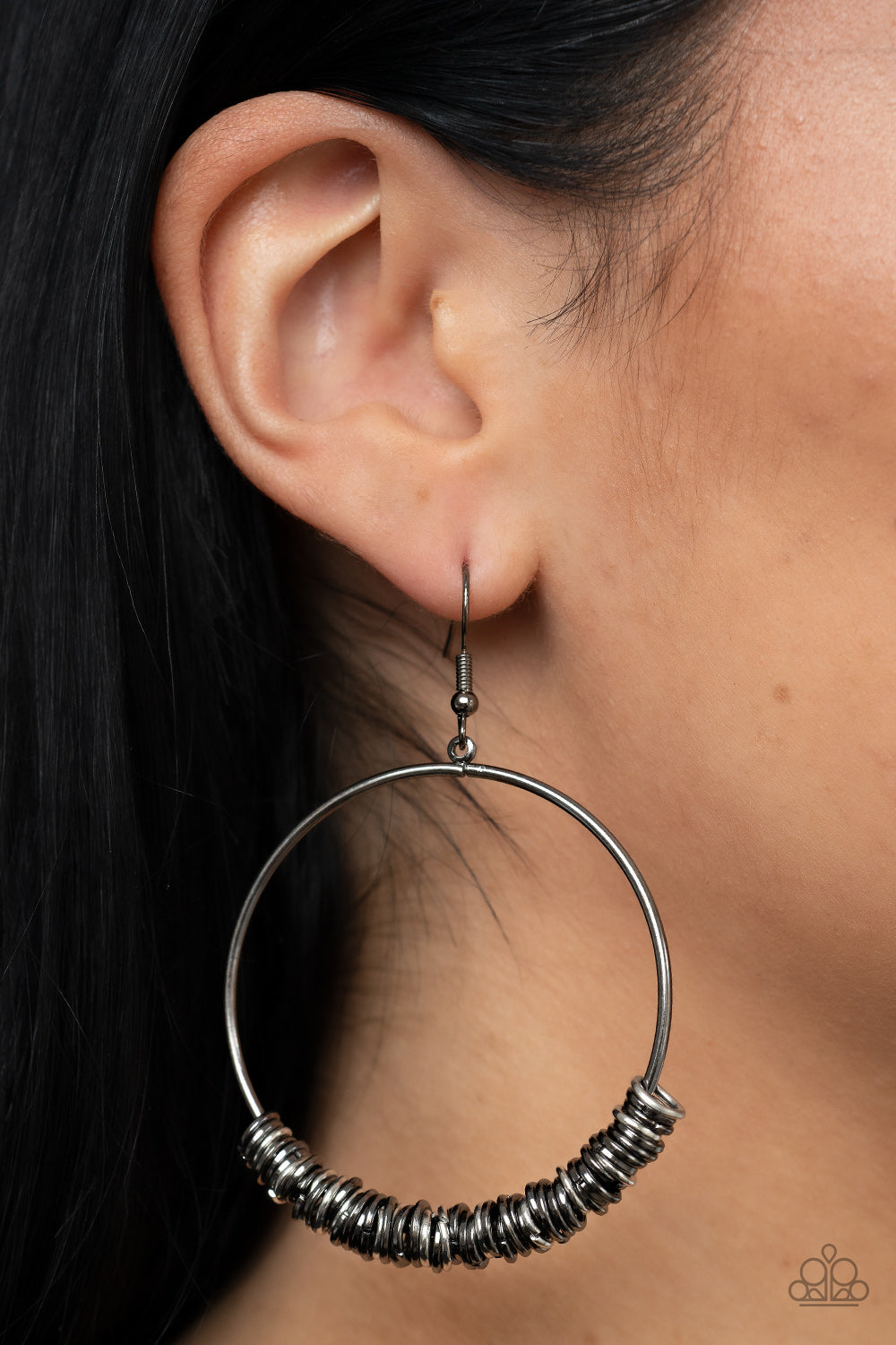 Retro Ringleader - Multi Earrings - Paparazzi Accessories An abundance of miniature gunmetal and silver rings slide around a simple gunmetal front-facing hoop, resulting in a polished industrial vibe. Earring attaches to a standard fishhook fitting.  Sold as one pair of earrings.