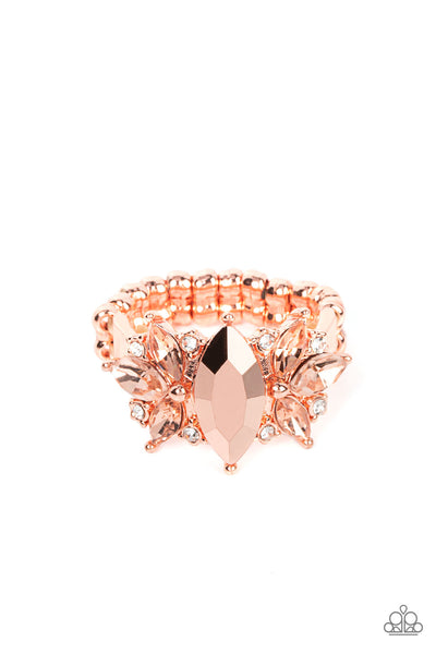 Luxury Luster - Copper Ring - Paparazzi Accessories An effervescent collection of dainty white rhinestones and marquise cut coppery rhinestones fans out from the sides of a marquise cut coppery aurum gem, exploding into a jaw-dropping centerpiece atop the finger. Features a dainty stretchy band for a flexible fit.  Sold as one individual ring.  New Kit