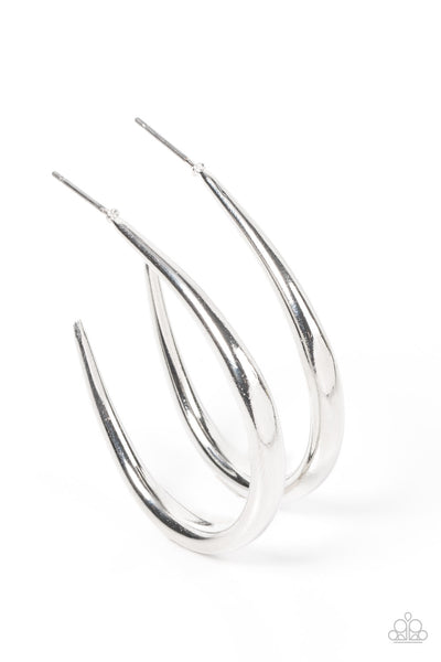 CURVE Your Appetite - Silver Hoop Earrings  - Paparazzi Accessories A shiny silver bar sharply curves into an asymmetrical hoop, adding a flash of metallic edge to any outfit. Earring attaches to a standard post fitting. Hoop measures approximately 1 1/4" in diameter.  Sold as one pair of hoop earrings.  New Kit