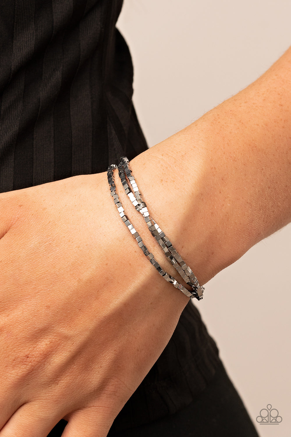 Block Bash - Silver Stretch Bracelets - Paparazzi Accessories A dainty collection of silver cube beads alternates along stretchy bands, stacking into edgy layers around the wrist.  Sold as one set of three bracelets.