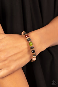 Durango Drifter - Multi Bracelet - Paparazzi Accessories Glassy multicolored stone beads join trios of black and brown wooden discs along stretchy bands around the wrist, resulting in an earthy pop of color.  Sold as one individual bracelet.