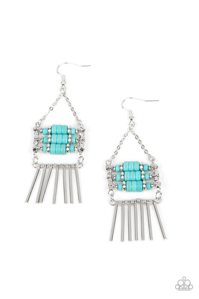 Tribal Tapestry - Blue Earrings - Paparazzi Accessories Rows of cylindrical silver and turquoise stone beads are threaded along metal rods between faceted silver cubes. Silver rods stream out from the bottom of the stacked display, resulting in an earthy fringe. Earring attaches to a standard fishhook fitting.  Sold as one pair of earrings.